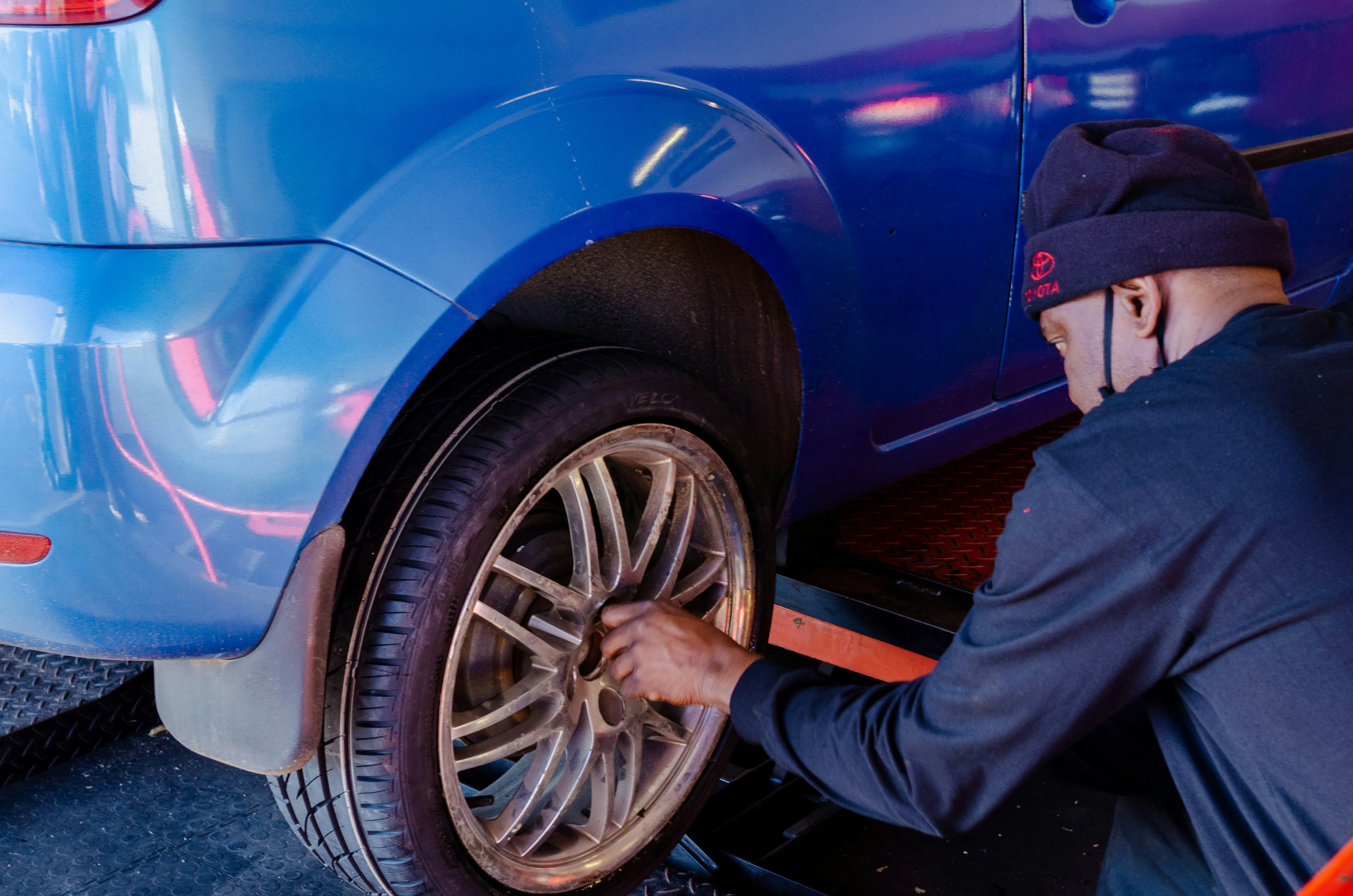 Cordier Enterprises technician inspecting a vehicle for managed car-sharing operations